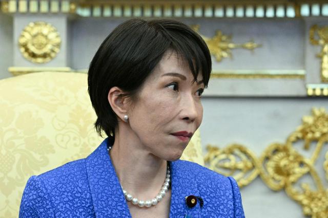 Japan's Prime Minister Sanae Takaichi looks on during a meeting with US President Donald Trump in the Oval Office of the White House in Washington on March 19, 2026. (Photo by Jim WATSON / AFP)