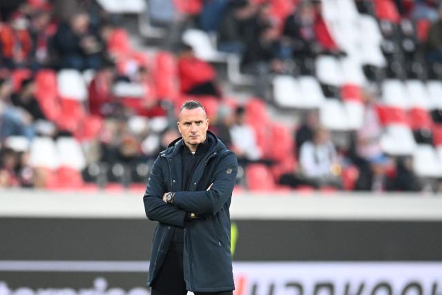 RC Genk's Belgian head coach Nicky Hayen is pictured on the pitch prior to the start of the UEFA Europa League, last 16 second leg, football match between SC Freiburg and KRC Genk in Freiburg, southwestern Germany, on March 19, 2026.  (Photo by THOMAS KIENZLE / AFP)