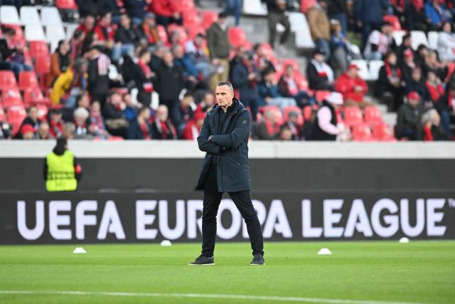 RC Genk's Belgian head coach Nicky Hayen is pictured on the pitch prior to the start of the UEFA Europa League, last 16 second leg, football match between SC Freiburg and KRC Genk in Freiburg, southwestern Germany, on March 19, 2026.  (Photo by THOMAS KIENZLE / AFP)