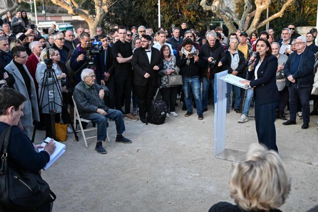 Far-right Rassemblement National (RN) Member of Parliament and Toulon mayoral candidate Laure Lavalette  R) gives a speech during a campaign meeting in Toulon, southeastern France, on March 19, 2026, ahead of the second round of the municipal elections. French voters are scheduled to head to the polls on March 22, 2026. (Photo by Miguel MEDINA / AFP)