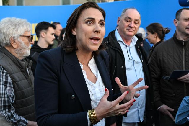 Far-right Rassemblement National (RN) Member of Parliament and Toulon mayoral candidate Laure Lavalette gestures as she speaks to the press during a campaign meeting in Toulon, southeastern France, on March 19, 2026, ahead of the second round of the municipal elections. French voters are scheduled to head to the polls on March 22, 2026. (Photo by Miguel MEDINA / AFP)