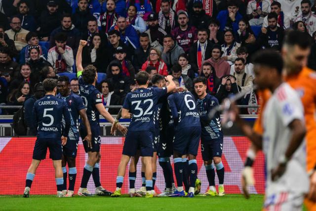 Celta Vigo's players celebrates after Javi Rueda scored a goal during the UEFA Europa League last 16 second leg football match between Olympique Lyonnais (OL) and Celta Vigo at the Groupama Stadium in Lyon, central-eastern France, on March 19, 2026. (Photo by OLIVIER CHASSIGNOLE / AFP)