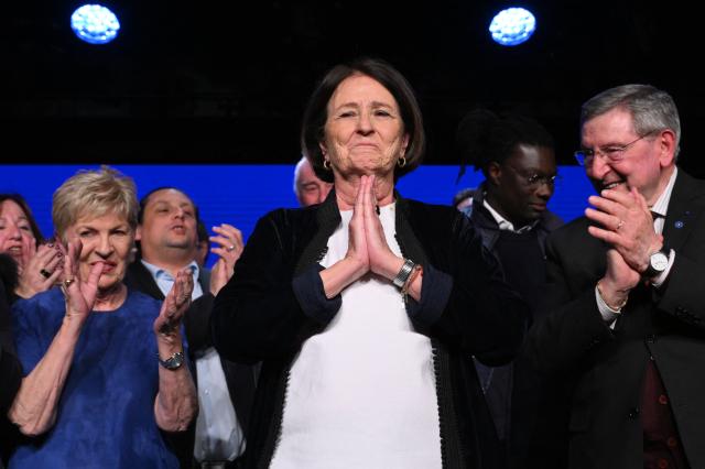 Toulon's incumbent mayor and candidate for her re-election Josée Massi (C) acknowledges applause during a campaign rally in Toulon, southern France, on March 19, 2026, ahead of France's upcoming municipal elections. (Photo by Elodie CLEMENT / AFP)