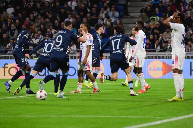 Celta Vigo's players celebrates after scoring a goal during the UEFA Europa League last 16 second leg football match between Olympique Lyonnais (OL) and Celta Vigo at the Groupama Stadium in Lyon, central-eastern France, on March 19, 2026. (Photo by OLIVIER CHASSIGNOLE / AFP)