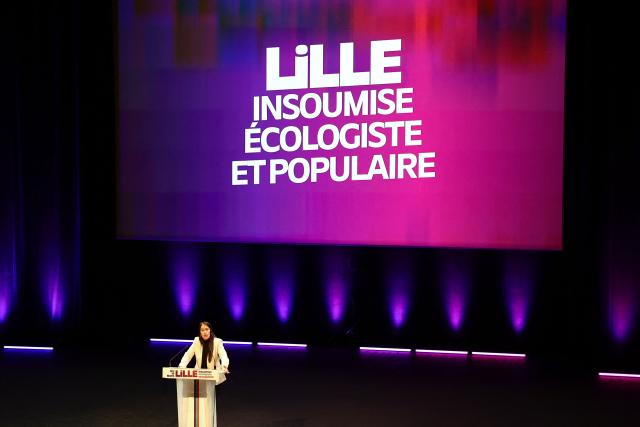 French leftist party La France Insoumise (LFI) candidate for mayor of Lille Lahouaria Addouche speaks during a campaign meeting in Lille, northern France, on March 19, 2026, ahead of the second round of France's 2026 municipal elections. French voters are scheduled to head to the polls for the second round of municipal elections on March 22, 2026. (Photo by Sameer AL-DOUMY / AFP)