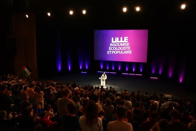 French leftist party La France Insoumise (LFI) candidate for mayor of Lille Lahouaria Addouche speaks during a campaign meeting in Lille, northern France, on March 19, 2026, ahead of the second round of France's 2026 municipal elections. French voters are scheduled to head to the polls for the second round of municipal elections on March 22, 2026. (Photo by Sameer AL-DOUMY / AFP)