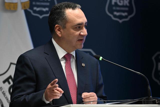 El Salvador’s Attorney General Rodolfo Delgado speaks during a press conference after a man was found in possession of $38 million dollars, accused of fraud at a credit company, at the headquarters of the Attorney General’s Office in San Salvador on March 19, 2026. (Photo by Marvin RECINOS / AFP)