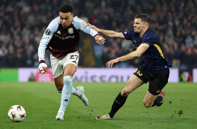 Lille's French defender #15 Romain Perraud (R) vies with Aston Villa's English midfielder #27 Morgan Rogers during the UEFA Europa League, round of 16 second-leg football match between Aston Villa and Lille LOSC at Villa Park in Birmingham, central England on March 19, 2026. (Photo by Darren Staples / AFP)