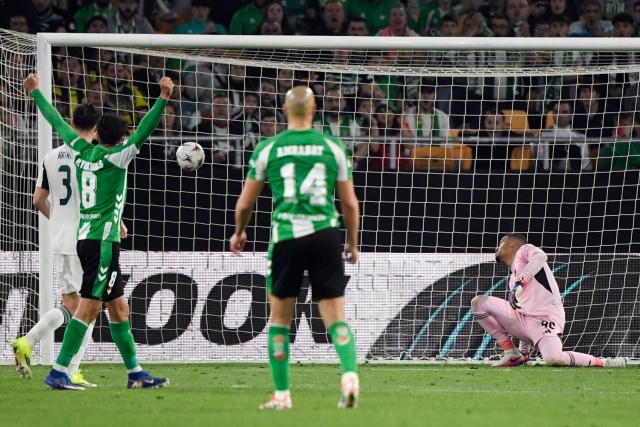 Real Betis' Moroccan midfielder #14 Sofyan Amrabat scores his team's second goal during the UEFA Europa League last 16 second leg football match between Real Betis and Panathinaikos FC at Benito Villamarin Stadium in Seville on March 19, 2026. (Photo by CRISTINA QUICLER / AFP)