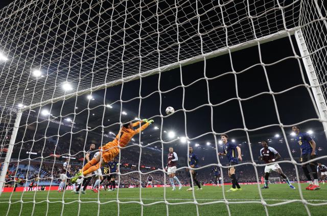 Lille's Turkish goalkeeper #01 Berke Ozer dives to make a save from a shot from Aston Villa's Belgian midfielder #24 Amadou Onana during the UEFA Europa League, round of 16 second-leg football match between Aston Villa and Lille LOSC at Villa Park in Birmingham, central England on March 19, 2026. (Photo by DARREN STAPLES / AFP)