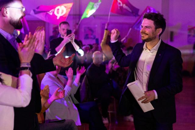 La France Insoumise (LFI) top candidate in the first round of Strasbourg's municipal election Florian Kobryn, who is now supporting incumbent mayor of Strasbourg and Les Ecologistes candidate for re-election Jeanne Barseghian in the second run, gestures before delivering a speech during a campaign rally in Strasbourg on March 19, 2026, ahead of the second round of France's municipal elections. Barseghian reached an agreement with Left-wing La France Insoumise (LFI) for the second round. (Photo by ROMEO BOETZLE / AFP)