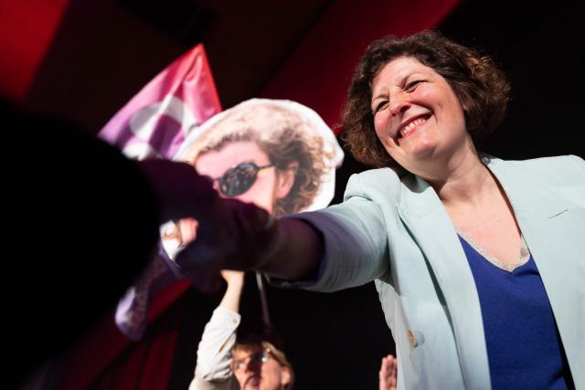 Incumbent mayor of Strasbourg and Les Ecologistes candidate for re-election Jeanne Barseghian shakes hands with a supporter during a campaign rally in Strasbourg on March 19, 2026, ahead of the second round of France's municipal elections. Barseghian, who has fallen behind the former Socialist mayor, reached an agreement with Left-wing La France Insoumise (LFI) for the second round. (Photo by ROMEO BOETZLE / AFP)