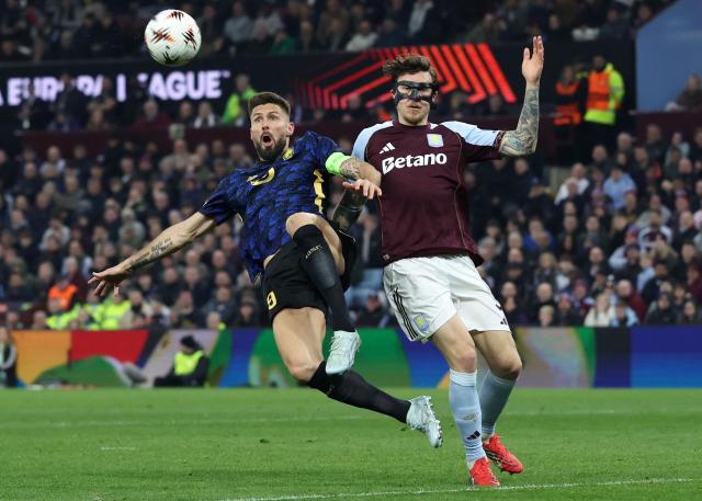 Aston Villa's Swedish defender #03 Victor Lindelof (R) defends from Lille's French striker #09 Olivier Giroud during the UEFA Europa League, round of 16 second-leg football match between Aston Villa and Lille LOSC at Villa Park in Birmingham, central England on March 19, 2026. (Photo by Darren Staples / AFP)