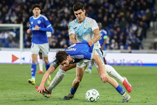 Rijeka’s Peruvian midfielder #55 Alfonso Barco (R) fights for the ball with Strasbourg’s Argentine forward #09 Joaquin Panichelli during the UEFA Europa Conference League last 16 second leg football match between RC Strasbourg Alsace and Rijeka at the Stade de la Meinau in Strasbourg, eastern France, on March 19, 2026. (Photo by Frederick FLORIN / AFP)