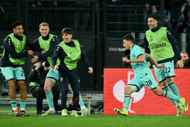 Bologna's Italian forward #28 Nicolo Cambiaghi celebrates scoring his team's fourth goal in the extra times during the UEFA Europa League last 16 2nd leg football match between AS Roma and Bologna at the Olympic Stadium in Rome on March 19, 2026. (Photo by Alberto PIZZOLI / AFP)