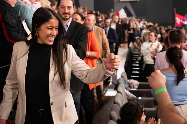 French leftist party La France Insoumise (LFI) candidate for mayor of Lille Lahouaria Addouche greets supporters during a campaign meeting in Lille, northern France on March 19, 2026, ahead of the second round of France's 2026 municipal elections. French voters are scheduled to head to the polls for the second round of municipal elections on March 22, 2026. (Photo by Elise HOUBEN / AFP)