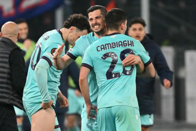 Bologna's Italian forward #28 Nicolo Cambiaghi celebrates scoring his team's fourth goal in the extra times during the UEFA Europa League last 16 2nd leg football match between AS Roma and Bologna at the Olympic Stadium in Rome on March 19, 2026. (Photo by Alberto PIZZOLI / AFP)