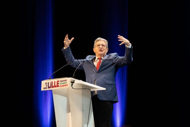 Founder of French left-wing party La France Insoumise (LFI) Jean-Luc Melenchon gestures as he addresses supporters during a campaign meeting in Lille, northern France on March 19, 2026, ahead of the second round of France's 2026 municipal elections. French voters are scheduled to head to the polls for the second round of municipal elections on March 22, 2026. (Photo by Elise HOUBEN / AFP)