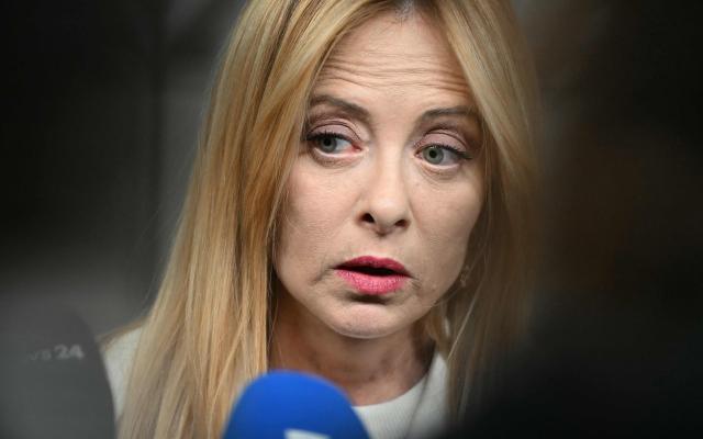 Italy's Prime Minister Giorgia Meloni speaks at a press conference during the EU Summit at the EU headquarters in Brussels, on March 19, 2026. European Union leaders meet in the context of the US-Israeli war against Iran that is consuming the Middle East, and its consequences on energy prices and security. (Photo by NICOLAS TUCAT / AFP)