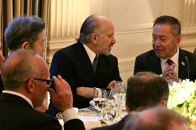 US Secretary of Commerce Howard Lutnick (C) attends a dinner with President Donald Trump and Japan's Prime Minister Sanae Takaichi in the State Dining Room of the White House in Washington on March 19, 2026. (Photo by Jim WATSON / AFP)
