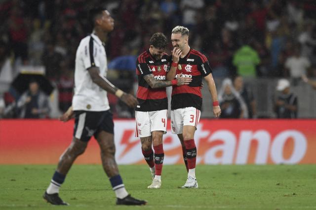 Flamengo's defender #03 Leo Ortiz (R) celebrates scoring his team's first goal during the Brasileirao Serie A football match between Flamengo and Remo at the Maracana Stadium in Rio de Janeiro, Brazil, on March 19, 2026. (Photo by Daniel RAMALHO / AFP)