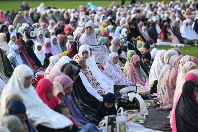Muslim devotees offer Eid al-Fitr prayer at Bali's Bajra Sandhi monument and park in Denpasar, on Indonesia's resort island of Bali on March 20, 2026, marking the end of holy month of Ramadan. (Photo by SONNY TUMBELAKA / AFP)