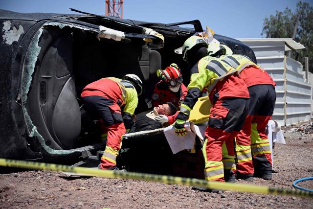Members of the Mexican Army Rescue Corps participate in a simulated accident as part of ‘Exercise Ollamani’ at the Santa Lucia Military Base in the municipality of Zumpango, State of Mexico, Mexico, on March 19, 2026. "Exercise Ollamani" is organized by various institutions—including the Mexican Army, the National Guard, and the Attorney General's Office—and serves as an anti-terrorism drill designed to safeguard the 2026 World Cup. (Photo by Alfredo ESTRELLA / AFP)