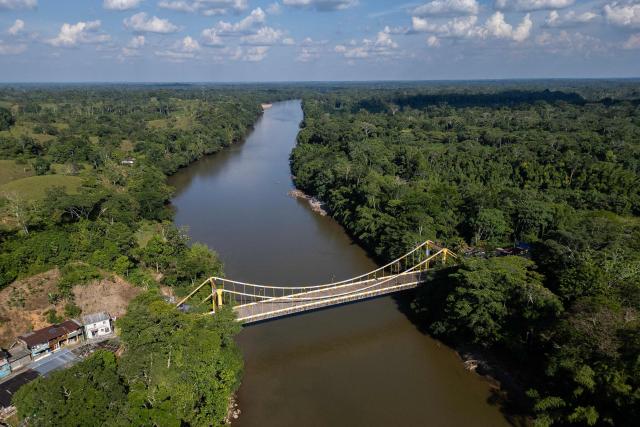 This aerial view shows the International Bridge San Miguel closed at the border between Colombia and Ecuador due to the commercial tax dispute between both countries, on March 19, 2026. Ecuador escalated a month-old trade war with Colombia on February 26, 2026, hiking tariffs on imports from its neighbor to 50 percent over Bogota's alleged failure to combat organized crime along their shared border. (Photo by Luis ACOSTA / AFP)