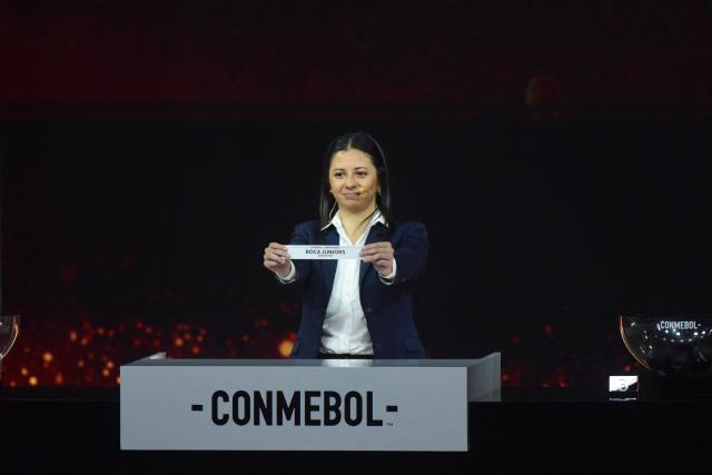 Conmebol Competition Manager Luciana Antunez shows the slip of Argentina's Boca Juniors during the Copa Libertadores group-stage draw in Luque, Asuncion, on March 19, 2026. (Photo by DANIEL DUARTE / AFP)