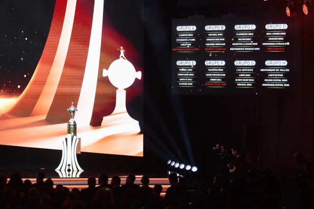 The board showing the composition of the groups is seen during the Copa Libertadores group-stage draw in Luque, Asuncion, on March 19, 2026. (Photo by DANIEL DUARTE / AFP)