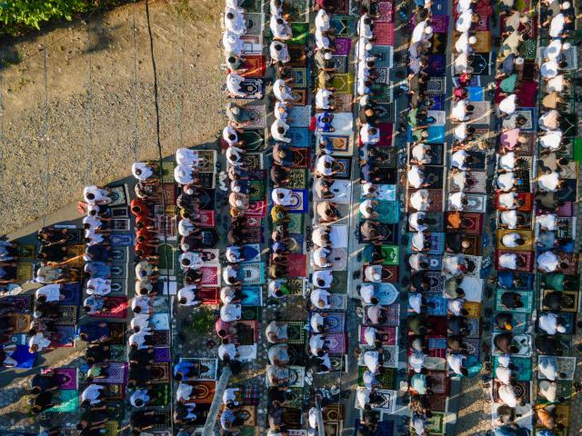 Muslim devotees take part in a morning prayer celebrating Eid al-Fitr, which marks the end of the holy month of Ramadan, in the compounds of the Muhammadiyah University in Banda Aceh on March 20, 2026. (Photo by CHAIDEER MAHYUDDIN / AFP/Chaideer MAHYUDDIN / AFP)