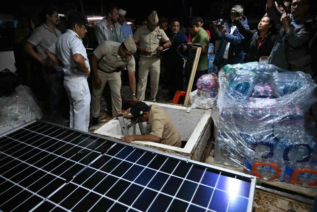 Officials from the Puerto Progreso Port Captaincy inspect the inside of a boat, nicknamed ‘Grandma 2’, as they prepare for its departure to deliver humanitarian assistance to Cuba, as part of the Convoy to Cuba organized by left-wing activists from various countries in the Americas and Europe, in Puerto Progreso, Yucatan state, Mexico, on March 19, 2026. The first shipment of international aid for crisis-hit Cuba arrived in the country from Europe on March 18, 2026 in the shape of five tons of medical supplies. (Photo by YURI CORTEZ / AFP)