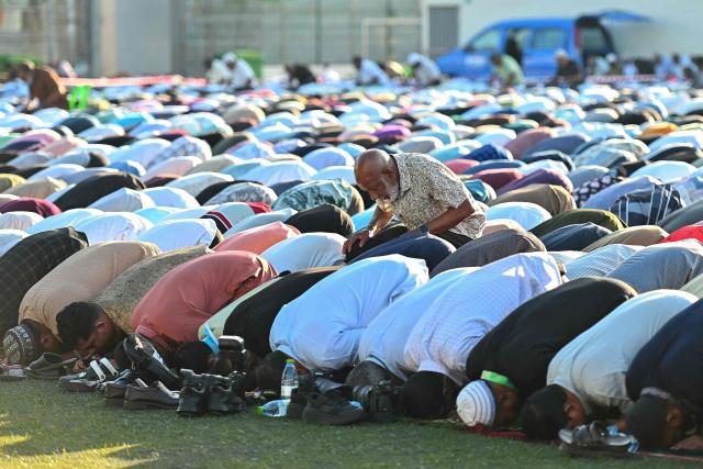 Muslim devotees offer Eid al-Fitr prayers, which marks the end of the Islamic holy fasting month of Ramadan, in Male on March 20, 2026. (Photo by Mohamed Afrah / AFP)