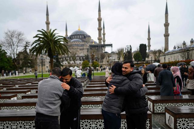 Muslim devotees attend the morning prayers celebrating the holiday of Eid al-Fitr, marking the end of the holy month of Ramadan, at the Blue Mosque, in Istanbul, on March 20, 2026. (Photo by Yasin AKGUL / AFP)
