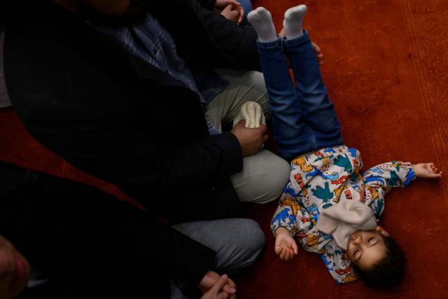 Muslim devotees attend the morning prayers celebrating the holiday of Eid al-Fitr, marking the end of the holy month of Ramadan, at the Blue Mosque, in Istanbul, on March 20, 2026. (Photo by Yasin AKGUL / AFP)