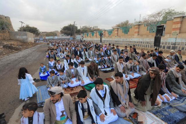 Yemenis attend the morning Eid al-Fitr prayers, which marks the end of the holy fasting month of Ramadan, outside a mosque in the capital Sanaa on March 20, 2026. (Photo by Mohammed HUWAIS / AFP)
