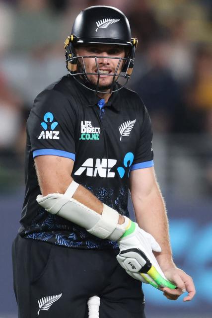 New Zealand’s Tom Latham reacts after injuring his hand during the third Twenty20 international cricket match between New Zealand and South Africa at Eden Park in Auckland on March 20, 2026. (Photo by Michael Bradley / AFP)