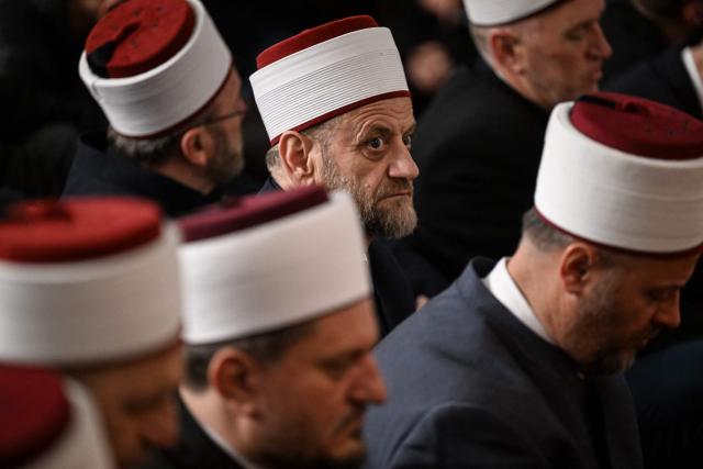Muslim devotees attend the morning prayers for Eid al-Fitr which marks the end of the holy fasting month of Ramadan, at the Grand Mosque of Pristina on March 20, 2026. (Photo by Armend NIMANI / AFP)