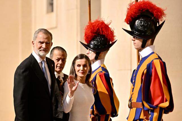 King Felipe VI of Spain and Queen Letizia arrive for a private audience with Pope Leo XiV on March 20, 2026 at San Damaso courtyard in The Vatican. (Photo by Filippo MONTEFORTE / AFP)