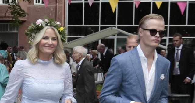(FILES) Picture taken on June 23, 2016 in Trondheim, Norway, shows Norwegian Crown Princess Mette-Marit with her son Marius Borg Høiby as they attend a garden party. Norway's Crown Princess Mette-Marit said she was "manipulated" by convicted US sex offender Jeffrey Epstein, in an interview broadcast on March 20, 2026 in which she sought to explain their close relationship. A commoner who married Crown Prince Haakon in 2001, Mette-Marit's name appears in new Epstein documents released by the US Department of Justice earlier in 2026. The files revealed an unexpectedly close friendship between the pair and raised questions in Norway about whether Mette-Marit can become queen. (Photo by Lise Åserud / NTB / AFP) / Norway OUT