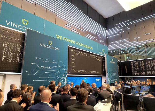 People applaud during the initial public offering (IPO) of German defence supplier Vincorion at the stock exchange in Frankfurt am Main, western Germany, on March 20, 2026. Vincorion's shares jumped on its IPO, underscoring investor appetite for the arms industry as Europe races to re-build its militaries. Investments into the weapons sector have surged as the continent overhauls its long-neglected armies to face a hostile Russia and as worries grow about US security commitments. Vincorion develops power supply systems and other technology for tanks and aircraft. (Photo by Jean-Philippe LACOUR / AFP)