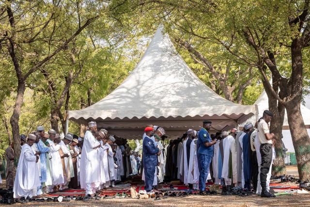 Muslim devotees offer Eid al-Fitr prayers, marking the end of the holy month of Ramadan, at the National Eid prayer ground in Abuja on March 20, 2026. (Photo by Light Oriye Tamunotonye / AFP)