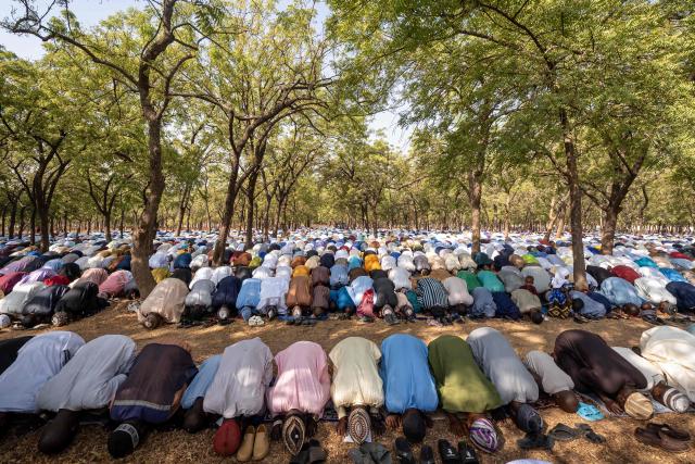 Muslim devotees offer Eid al-Fitr prayers, marking the end of the holy month of Ramadan, at the National Eid prayer ground in Abuja on March 20, 2026. (Photo by Light Oriye Tamunotonye / AFP)