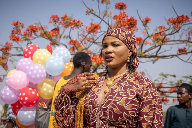 A Muslim devotee poses for a group photo after Eid al-Fitr prayers, marking the end of the holy month of Ramadan, at the National Eid prayer ground in Abuja on March 20, 2026. (Photo by Light Oriye Tamunotonye / AFP)