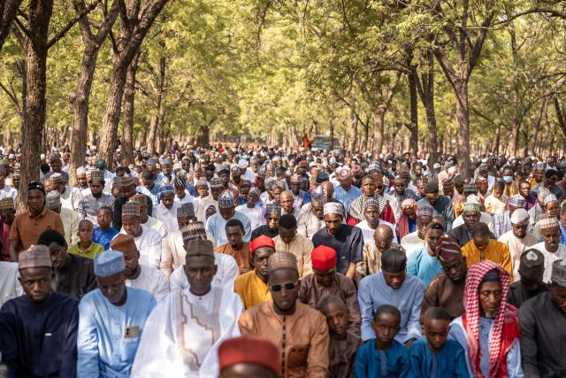 Muslim devotees offer Eid al-Fitr prayers, marking the end of the holy month of Ramadan, at the National Eid prayer ground in Abuja on March 20, 2026. (Photo by Light Oriye Tamunotonye / AFP)