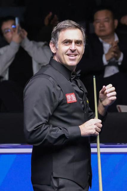 Britain's Ronnie O'Sullivan reacts after making professional snooker history with the highest ever break of 153 during his match against Ryan Day of Wales at the Snooker World Open in Yushan, in China’s Jiangxi province on March 20, 2026. (Photo by CN-STR / AFP) / China OUT
