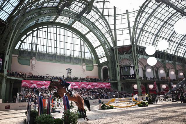 France's Nicolas Layec riding Hatlantika competes during the "Prix du Grand Palais" of "Le Saut Hermès" horse International Jumping Competition at the Grand Palais in Paris, on March 20, 2026. (Photo by Anne-Christine POUJOULAT / AFP)