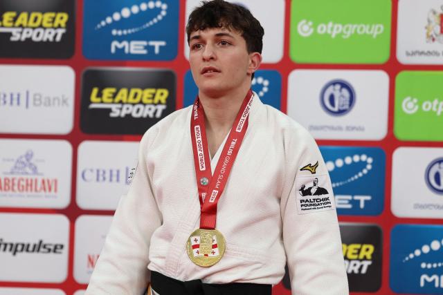 Gold medallist Israel's Izhak Ashpiz poses during a ceremony for the men's under 60 kg event at the Tbilisi Grand Slam judo tournament in Tbilisi on March 20, 2026. (Photo by Giorgi ARJEVANIDZE / AFP)
