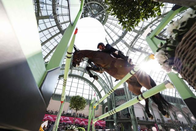 France's Jeremy Le Roy riding Falkira de Mormoulins during the "Prix du Grand Palais" of "Le Saut Hermès" horse International Jumping Competition at the Grand Palais in Paris, on March 20, 2026. (Photo by Anne-Christine POUJOULAT / AFP)