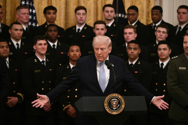 US President Donald Trump speaks during a ceremony to present the Commander-in-Chief Trophy to the Navy Midshipmen football team of the United States Naval Academy in the East Room of the White House in Washington, DC, on March 20, 2026. (Photo by Brendan SMIALOWSKI / AFP)